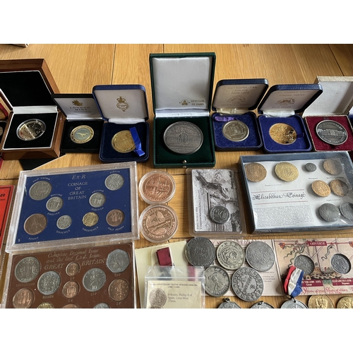 402 - A collection of coins and medals, together with share certificates, stamps, and some reproduction co... 