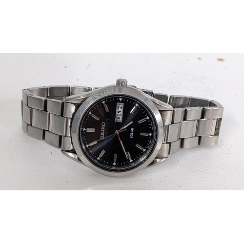 406 - A Seiko gents day/date stainless steel wristwatch, Location:T