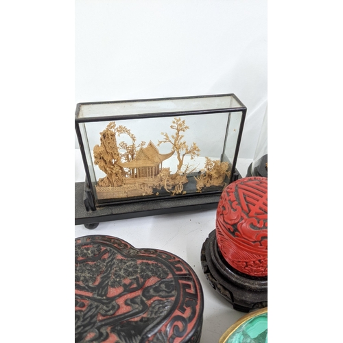 416 - An oriental lot to include three Chinese cork Diorama, a Cinnabar box, together with Cinnabar trinke... 