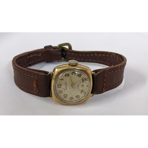 426 - An early 20th century Everite 9ct gold manual wind wristwatch on a brown leather strap, Location:CAB... 