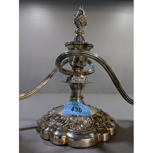 430 - A pair of silver plated, twin handled candelabras on weighted elaborate bases, 18cm, Location:4.1