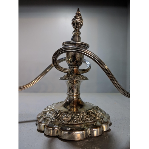 430 - A pair of silver plated, twin handled candelabras on weighted elaborate bases, 18cm, Location:4.1