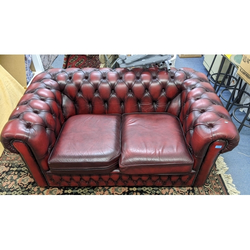 276 - A mid 20th century red leather two seater Chesterfield sofa , 68h x 154w, Location:RAF