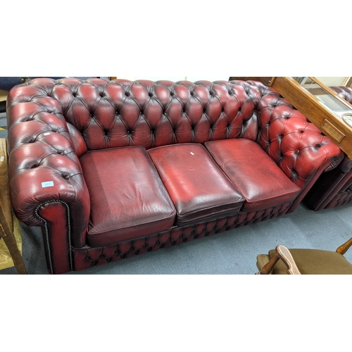 277 - A mid 20th century red leather three seater Chesterfield sofa, 68h x 188w, Location:A2F