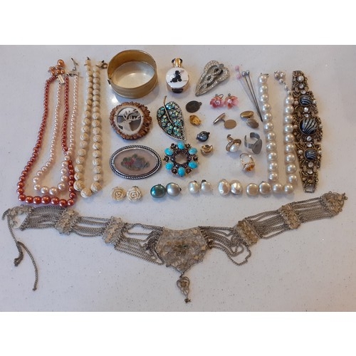 99 - A quantity of vintage costume jewellery to include a carved ivory style necklace with matching earri... 