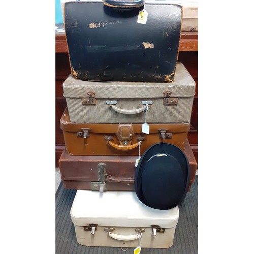 161 - A mixed lot to include four 1920's-1960's suitcases together with a late 20th Century black briefcas... 