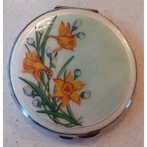 126 - A 1960's/70's Birmingham white metal and enamelled compact with yellow daffodil design to the lid, m... 