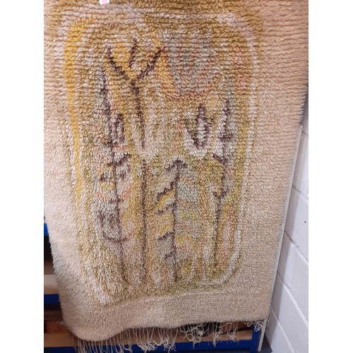 148 - A 1960's hand loomed cream ground Rya rug/wall tapestry in  'Fairy Tale Forest' designed by Aappo Ha... 