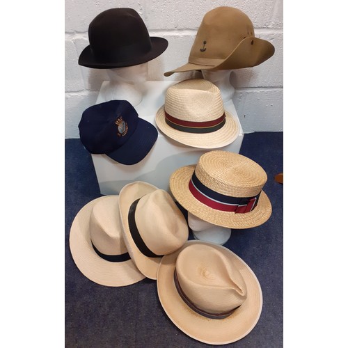 150 - A group of hats to include a Battersby school boater size 6⅞, a RWAFF wide brim felt hat, 4 straw ha... 