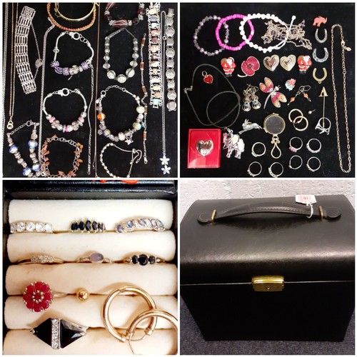 151 - A modern black casket jewellery chest and contents to include an engraved rolled gold bangle with sa... 