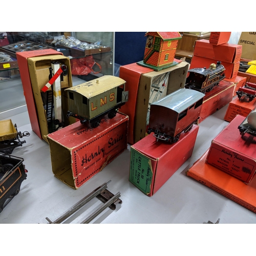 138 - A collection of boxed and loose Hornby O gauge to include several engines, tracks, carriages and acc... 