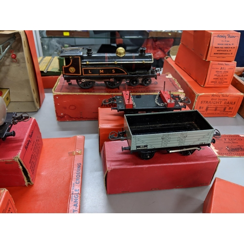 138 - A collection of boxed and loose Hornby O gauge to include several engines, tracks, carriages and acc... 