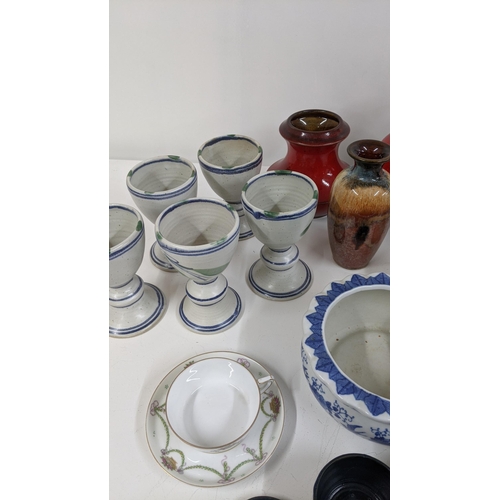 185 - A mixed lot to include a 19th century jug, studio pottery, flower posy signed to the base and other ... 