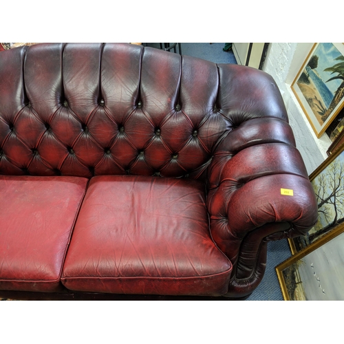 202 - One Chesterfield red leather two-seater sofa Location:RAF