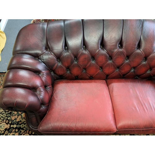 202 - One Chesterfield red leather two-seater sofa Location:RAF