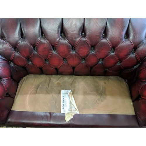 202 - One Chesterfield red leather two-seater sofa Location:RAF