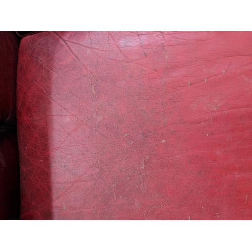 202 - One Chesterfield red leather two-seater sofa Location:RAF