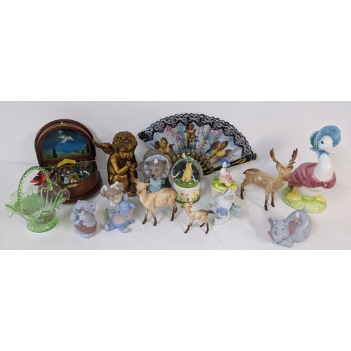 267 - A mixed lot to include a Danbury Mint Nativity music box, Nao figures, Beswick deer, and others Loca... 