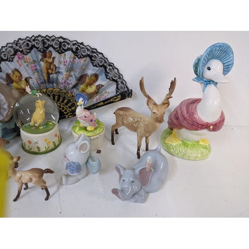 267 - A mixed lot to include a Danbury Mint Nativity music box, Nao figures, Beswick deer, and others Loca... 