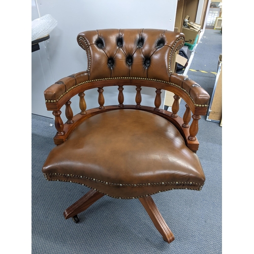 271 - A reproduction brown leather button back Chesterfield swivel Captain's armchair Location:A3B