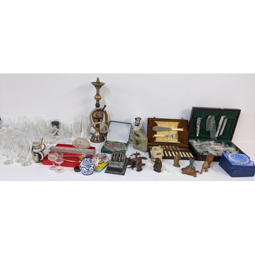 275 - A mixed lot to include two canteens of cutlery, hookah shisha, glassware, mixed treen and other item... 