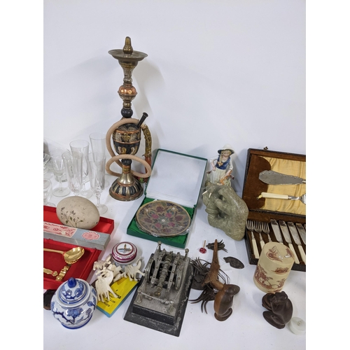 275 - A mixed lot to include two canteens of cutlery, hookah shisha, glassware, mixed treen and other item... 