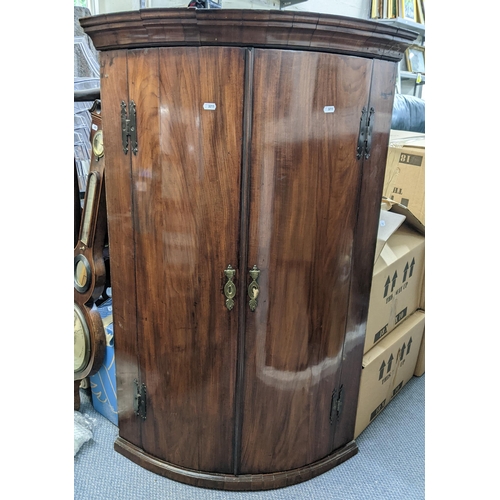 276 - A Georgian mahogany bow fronted wall hanging corner cabinet 111cm h x 73.5cm w 
Location: LAF