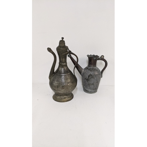 281 - A 19th/early 20th century Islamic tinned copper water jug, together with a copper Turkish coffee pot... 