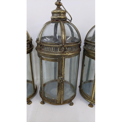 282 - A set of four brass finish classical style hexagonal dome lanterns on four claw feet Location:11.4