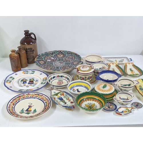 286 - A mixed lot to include a Moroccan ceramic charger, together with Quimper ware and stoneware bottles ... 