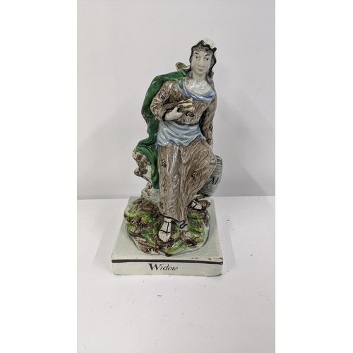 287 - An early 19th century Staffordshire pearlware figure of the widow of Zarephath A/F Location:6.1