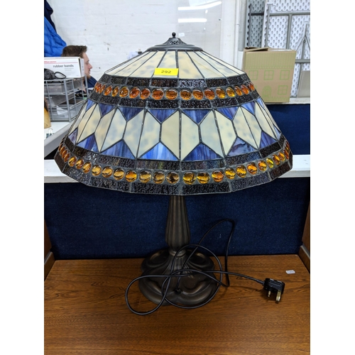 292 - A Tiffany style lamp and shade decorated in white and blue with orange beading Location:STAIRS