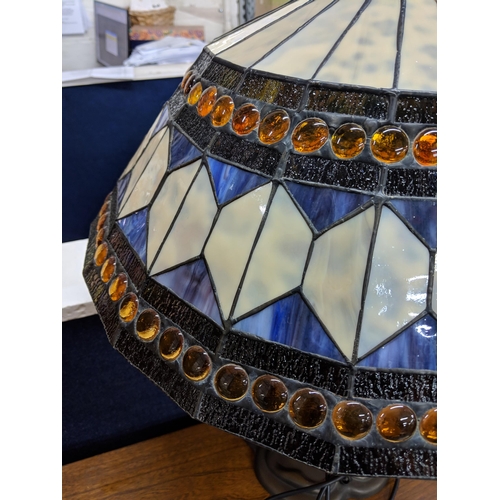 292 - A Tiffany style lamp and shade decorated in white and blue with orange beading Location:STAIRS