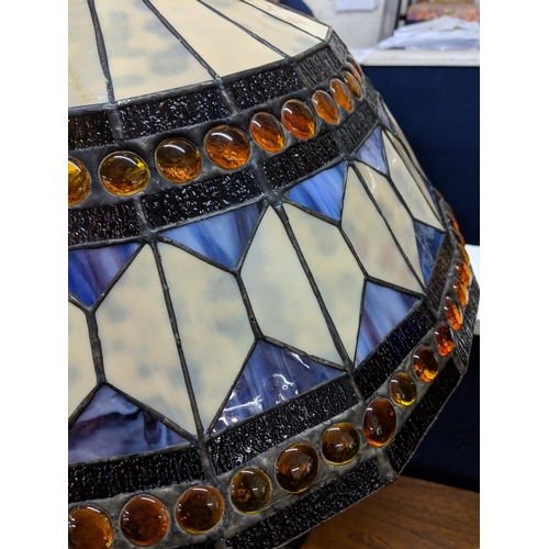 292 - A Tiffany style lamp and shade decorated in white and blue with orange beading Location:STAIRS