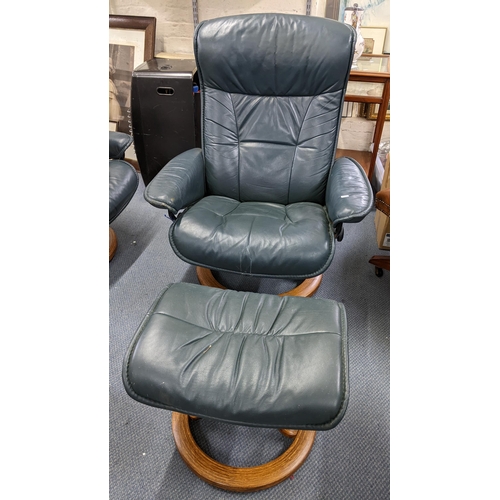 300 - An Ekaress green leather swivel armchair with a matching footstool
Location:A2B