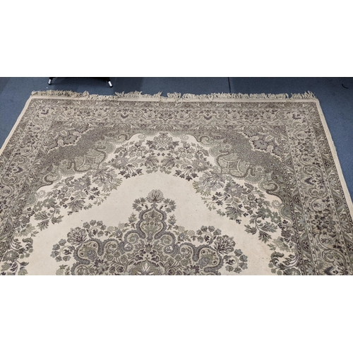 326 - A Super Keshan beige ground rug having a central motif with a floral design and tasselled ends, 346c... 