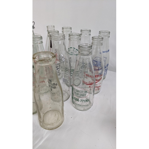 55 - Mixed glass ware to include a variety of vintage milk bottles together with crystal cut bowls and ot... 