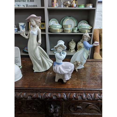 302 - Lladro and Nao Two Lladro bells and a Lladro collectors society plaque, also to include five Nao fig... 