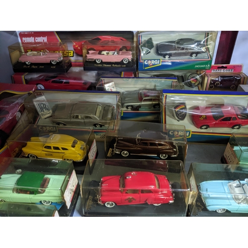 118 - A selection of mainly boxed diecast model cars to include Solido, Corgi Rolls Royce Cornish, and Jag... 