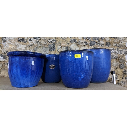 121 - A group of four blue glazed pottery garden pots, various sizes Location:G