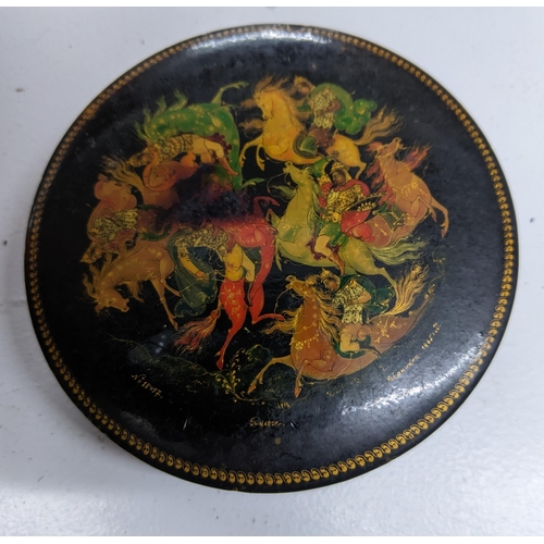 126 - A 1960s Russian lacquered paper mache circular box decorated with various figures on horseback numbe... 