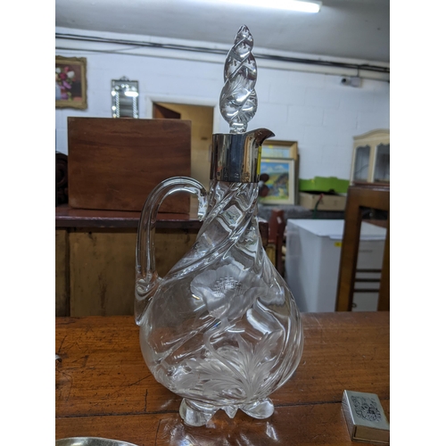 232 - A lot of silver and silver plated items to include a cut and engraved glass claret jug with silver c... 