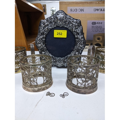 252 - A contemporary silver photograph frame with repousse decoration London 1990, marks for Keyford Frame... 