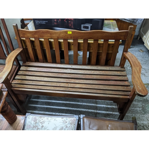 254 - A wooden slatted garden bench 88 x 135 x 59cms
Location:G