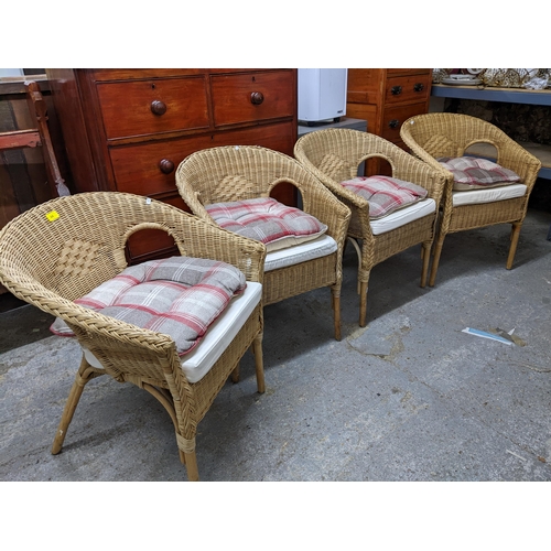 66 - Four wicker work armchairs with loose cushion seats Location:G