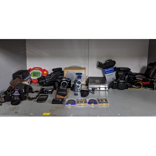 74 - A mixed lot of vintage film and digital cameras, Pure Digital Tempus 1 radio, games, camera accessor... 