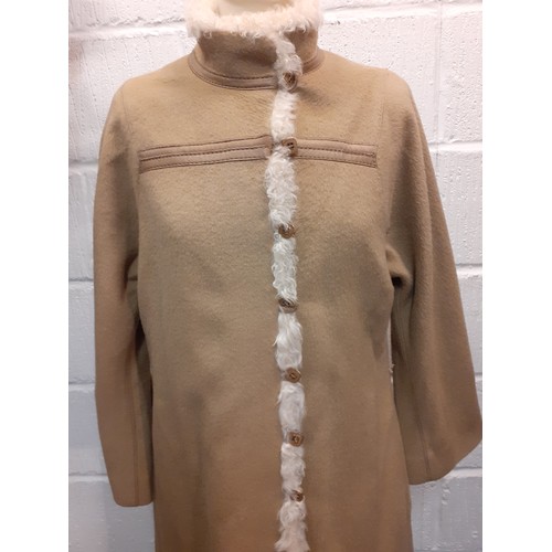 110 - A vintage Baccarat fawn ladies coat UK size 12 having 7 gold tone square button fastening with cream... 