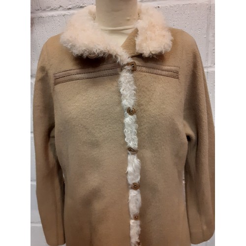 110 - A vintage Baccarat fawn ladies coat UK size 12 having 7 gold tone square button fastening with cream... 