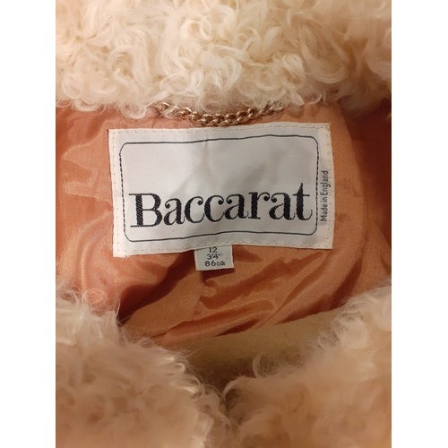 110 - A vintage Baccarat fawn ladies coat UK size 12 having 7 gold tone square button fastening with cream... 