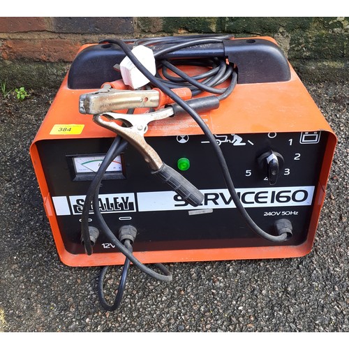 384 - A red Sealey Service 60, 12volt jump box with leads. Location:G